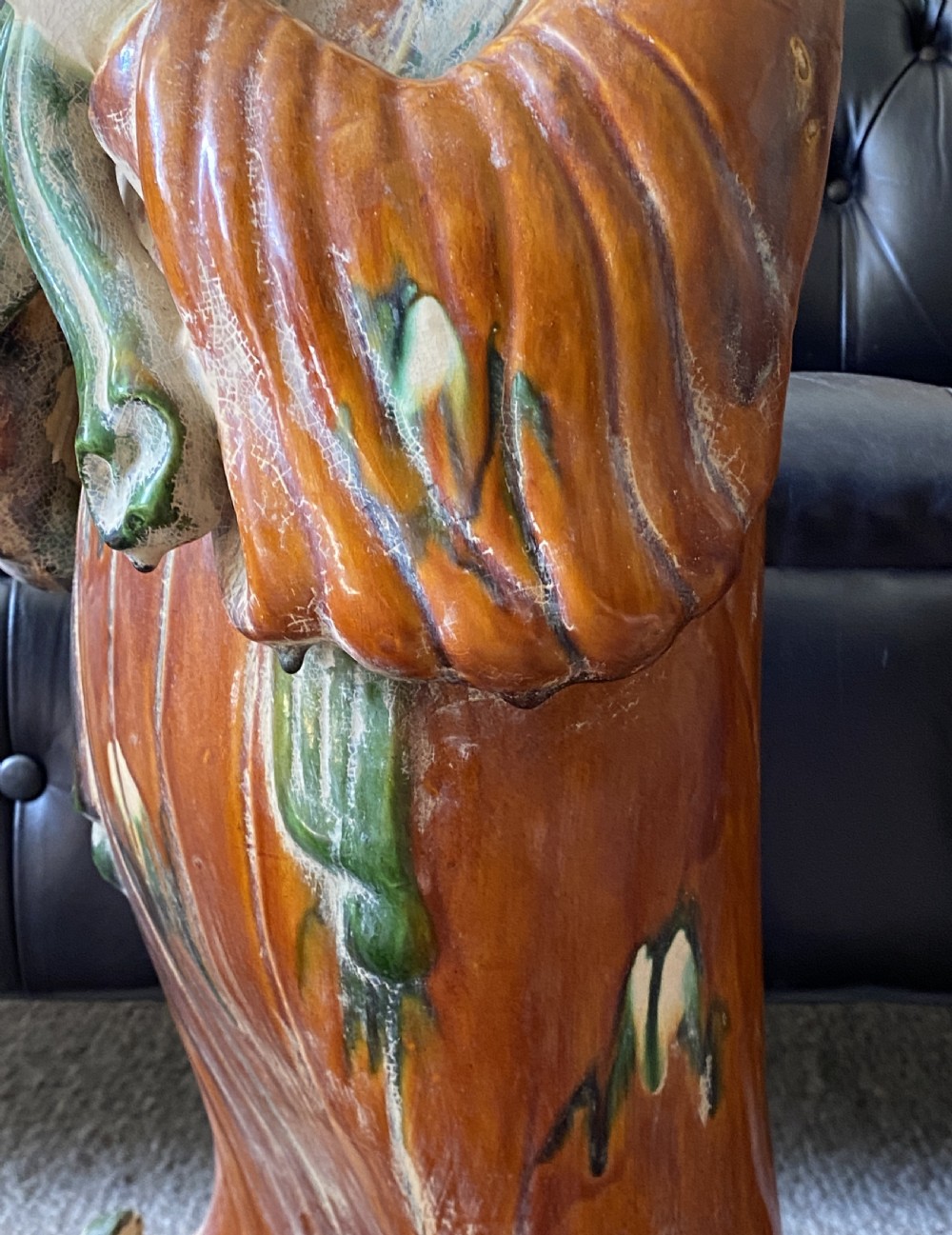 A pair of large Sancai glazed ceramic sculptures depicting Tang Dynasty style female court musicians in orange, green, and cream robes. View XXI