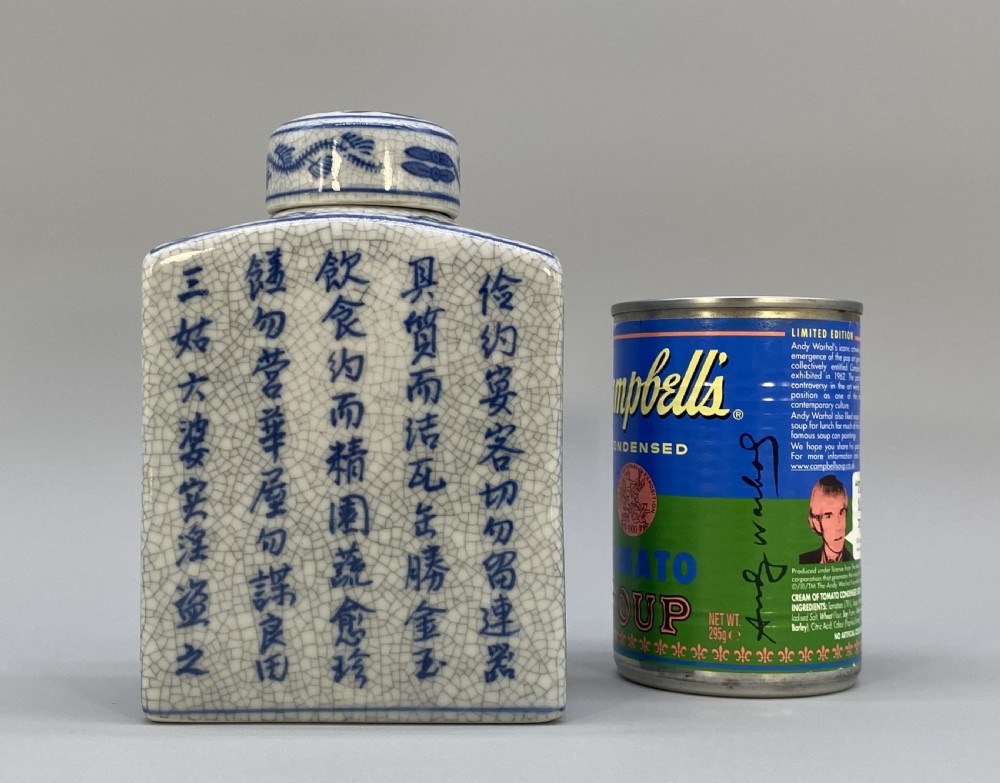 A rectangular blue and white crackle-glazed porcelain canister with a fitted lid, featuring vertical columns of hand-painted Chinese calligraphy. View III