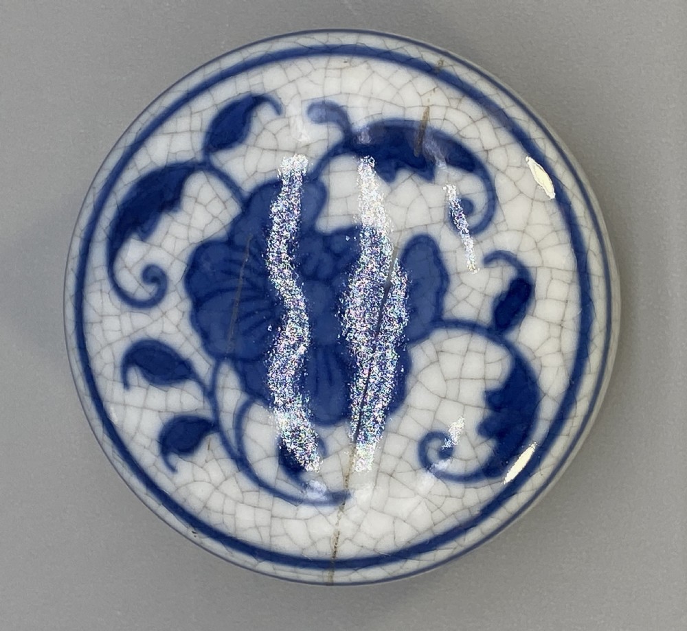 A rectangular blue and white crackle-glazed porcelain canister with a fitted lid, featuring vertical columns of hand-painted Chinese calligraphy. View XI