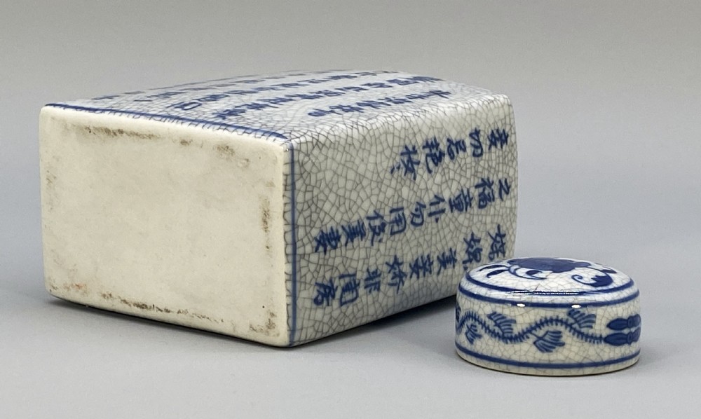 A rectangular blue and white crackle-glazed porcelain canister with a fitted lid, featuring vertical columns of hand-painted Chinese calligraphy. View XIII