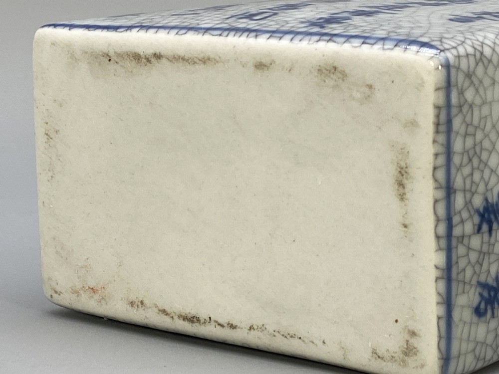 A rectangular blue and white crackle-glazed porcelain canister with a fitted lid, featuring vertical columns of hand-painted Chinese calligraphy. View XIV