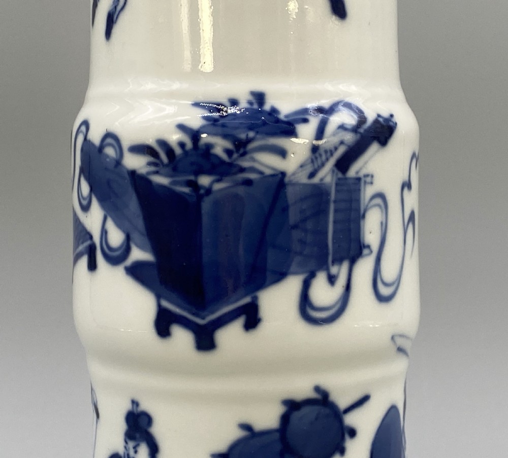 A tall, slender Chinese porcelain beaker vase painted in underglaze cobalt blue featuring equestrian figures and traditional motifs against a smooth white glaze. View XIV