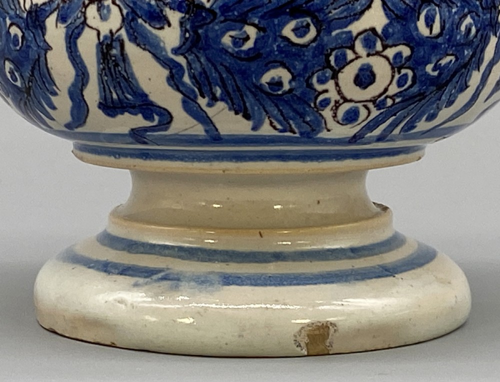 An 18th-century Italian majolica albarello pharmacy jar featuring a waisted silhouette with hand-painted blue floral patterns and central apothecary inscription. View VIII