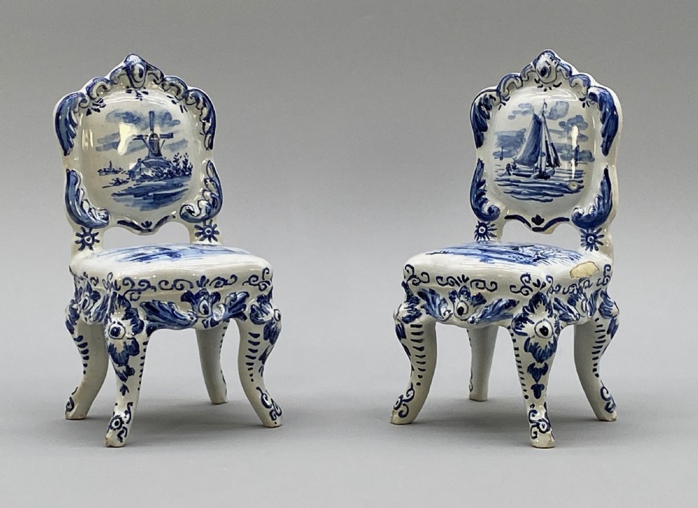 A four-piece set of miniature ceramic furniture decorated with hand-painted blue and white Dutch landscapes and windmill scenes. View XIII