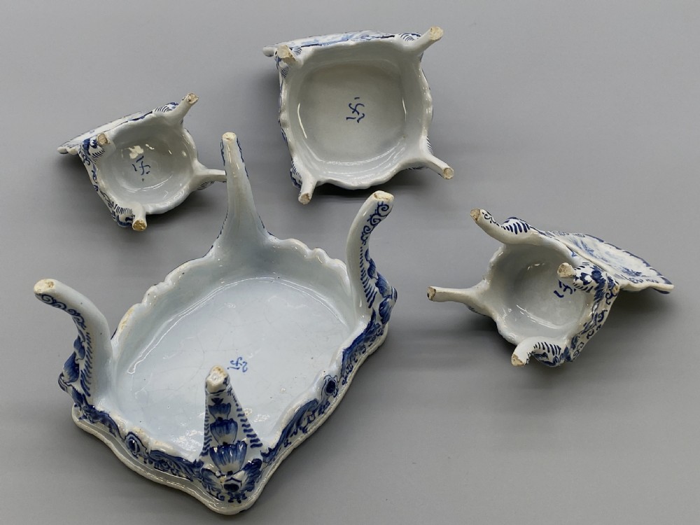 A four-piece set of miniature ceramic furniture decorated with hand-painted blue and white Dutch landscapes and windmill scenes. View XVII