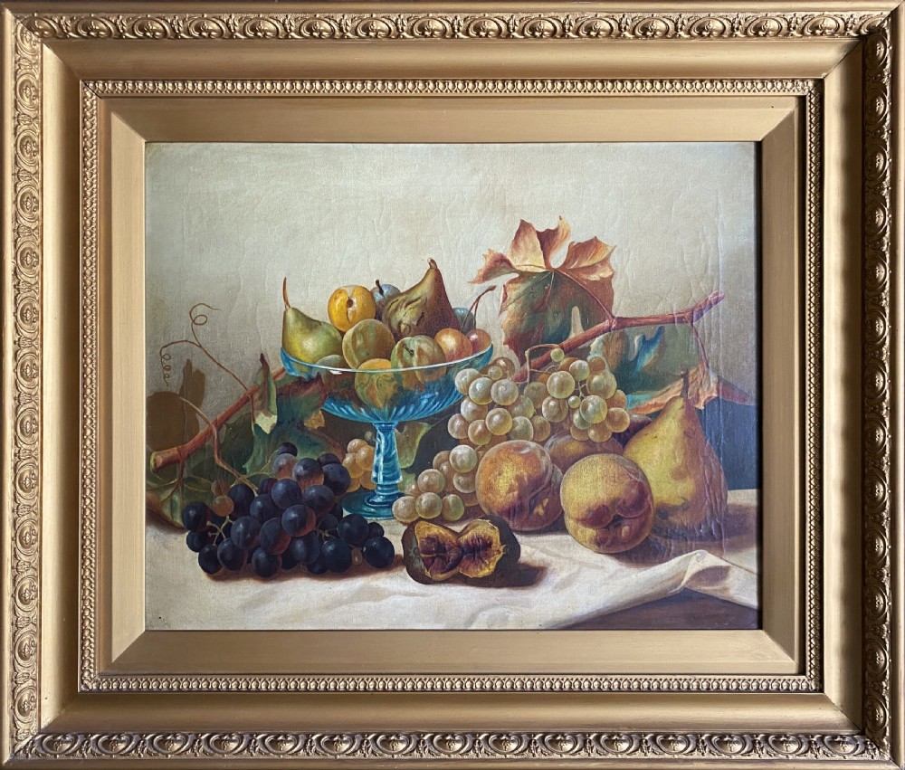 An oil painting depicting a still life composition of grapes, pears, peaches, and figs arranged on a draped cloth with a blue glass pedestal dish, enclosed in a moulded gilt frame. View XIII