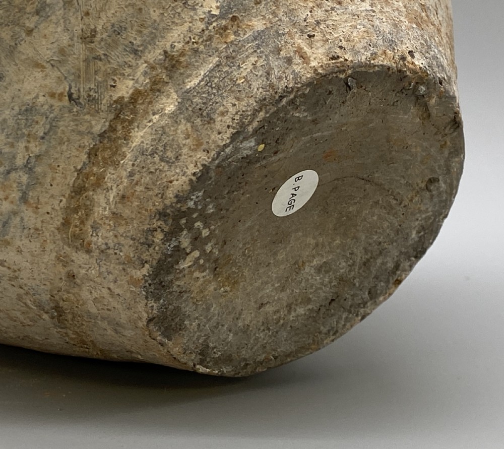 A painted terracotta vessel from the Tang Dynasty featuring a bulbous body, pointed finial lid, flared pedestal foot, and painted geometric scroll motifs in red and grey pigments. View XXI