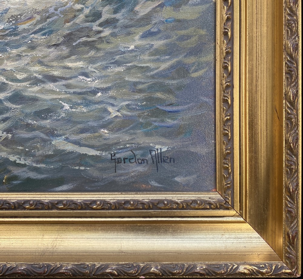A framed oil painting depicting a fishing trawler navigating choppy waves near a stone harbour lighthouse under a cloud-filled sky. View IX