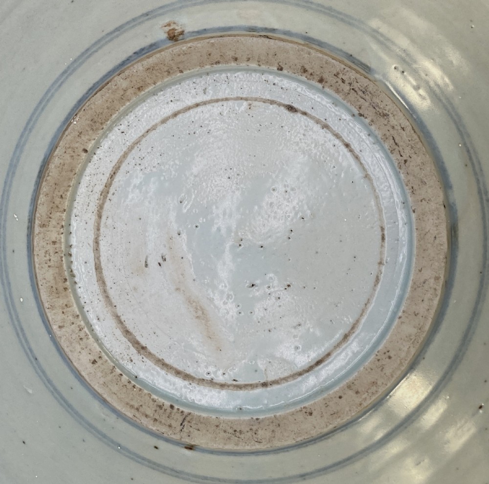 A circular 16th-century Chinese Swatow blue and white porcelain charger dish decorated with underglaze cobalt painted panels and central calligraphic motif. View XIV