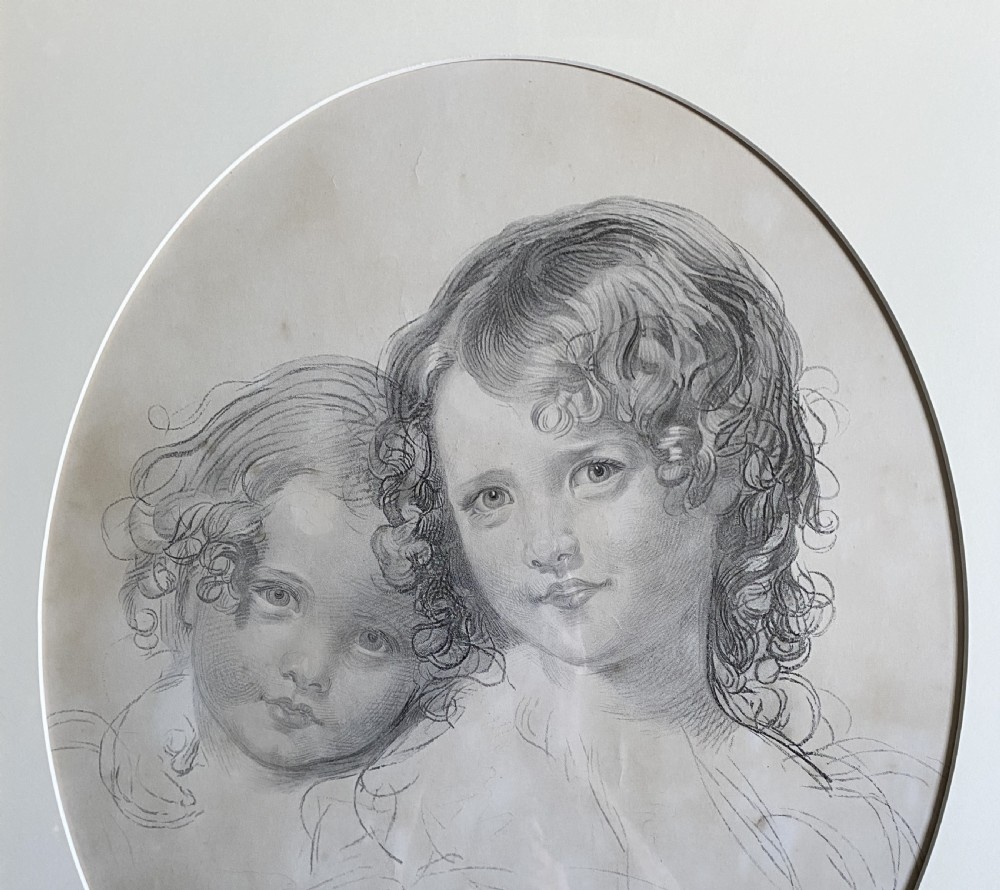 A 19th-century monochrome engraving depicting two young children set within an oval paper mount inside a moulded gold gilt frame. View IV