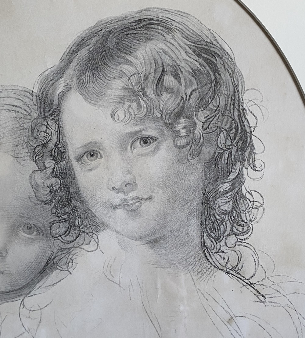 A 19th-century monochrome engraving depicting two young children set within an oval paper mount inside a moulded gold gilt frame. View VI
