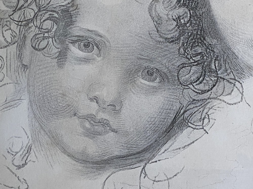 A 19th-century monochrome engraving depicting two young children set within an oval paper mount inside a moulded gold gilt frame. View X