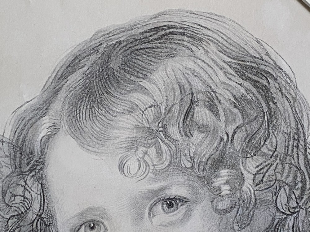 A 19th-century monochrome engraving depicting two young children set within an oval paper mount inside a moulded gold gilt frame. View XI