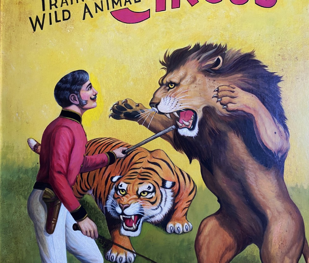 A framed mid-twentieth-century oil painting depicting a lion tamer confronting a roaring lion and a tiger against a yellow background with bold red circus lettering. View IV