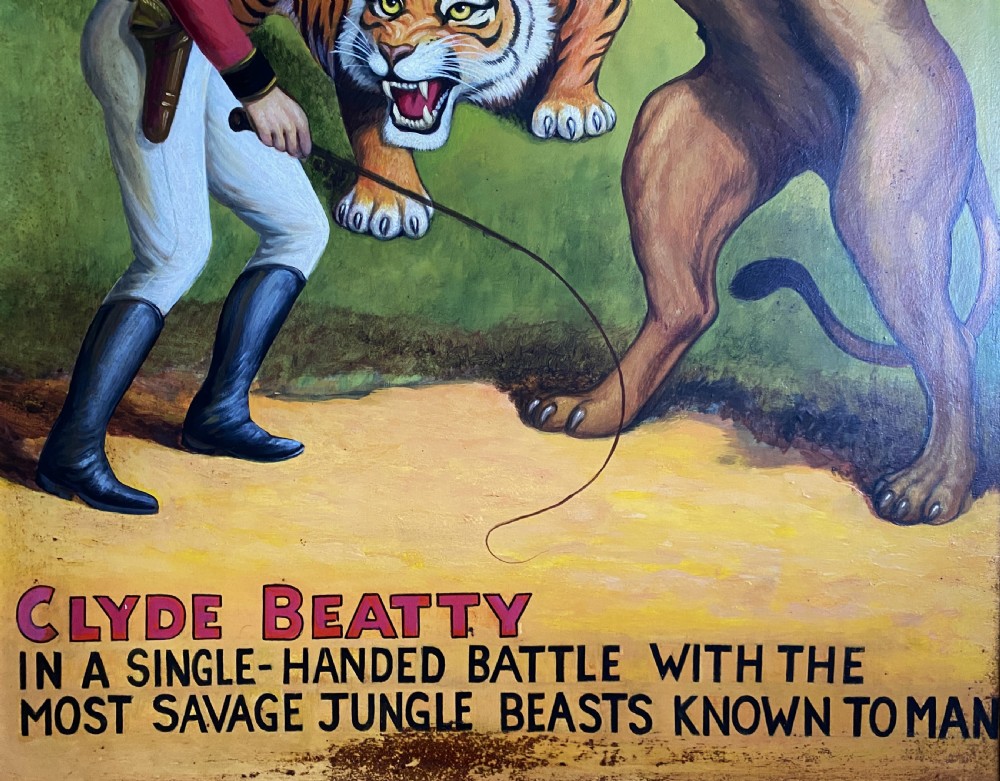 A framed mid-twentieth-century oil painting depicting a lion tamer confronting a roaring lion and a tiger against a yellow background with bold red circus lettering. View VIII
