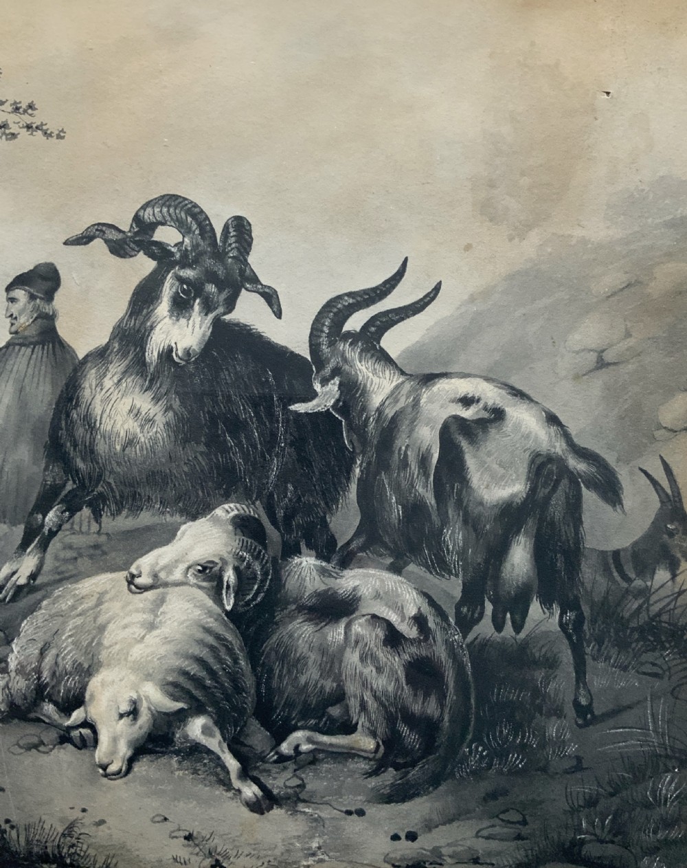 An early 19th-century monochrome pastoral artwork framed in gold, depicting a shepherd with cattle, goats, and sheep in a rocky landscape. View V