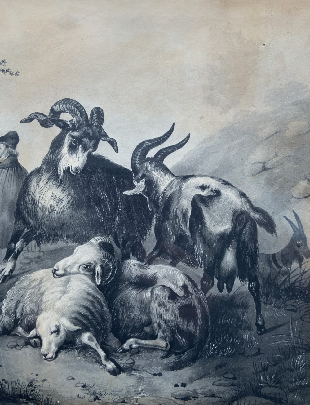 An early 19th-century monochrome pastoral artwork framed in gold, depicting a shepherd with cattle, goats, and sheep in a rocky landscape. View XII