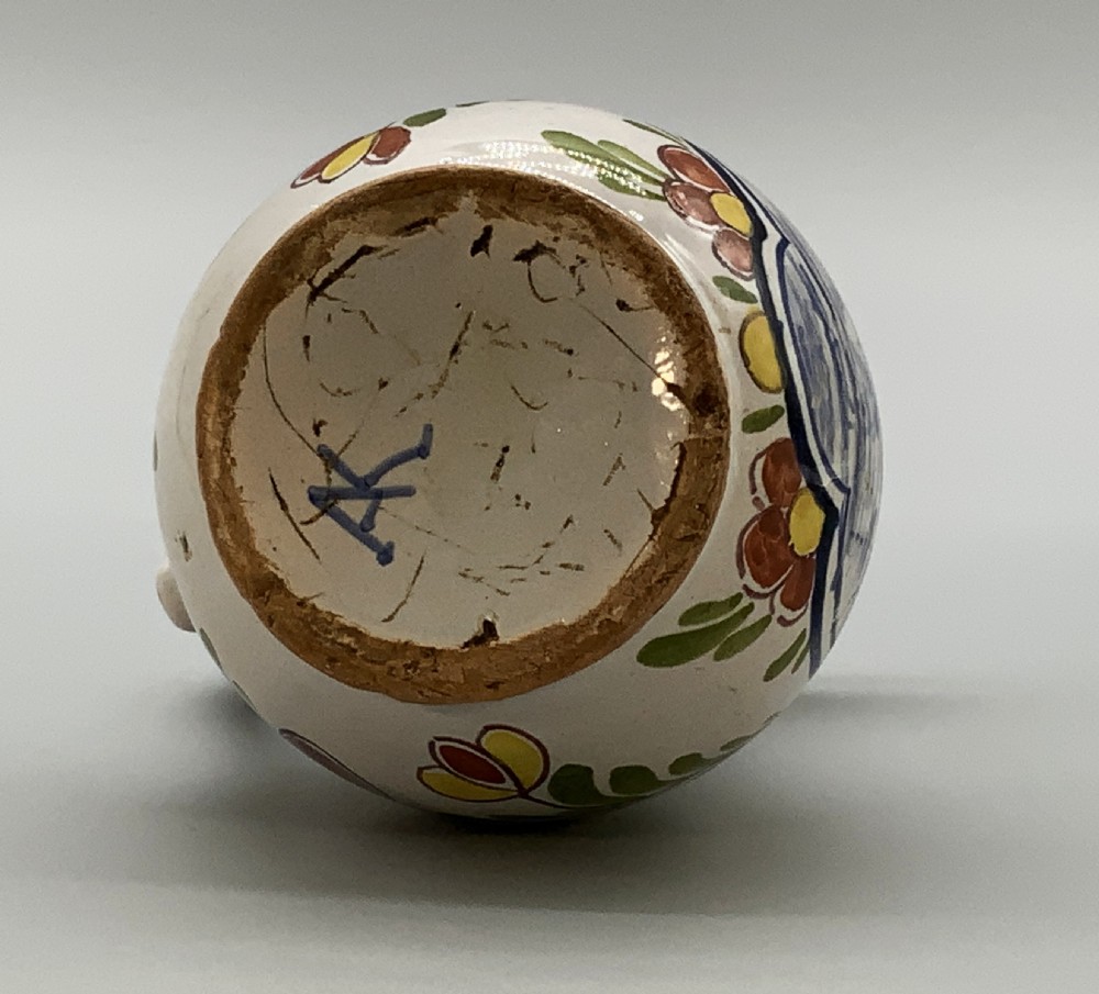 An 18th-century Dutch Delft tin-glazed ceramic coffee pot decorated with polychrome floral motifs and a central blue maritime landscape medallion. View XIII
