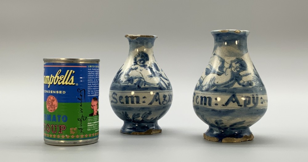 Pair of 17th-century Italian Savona majolica apothecary bottles with cobalt blue hand-painted putti and Latin inscriptions over a tin-glazed ground. View II