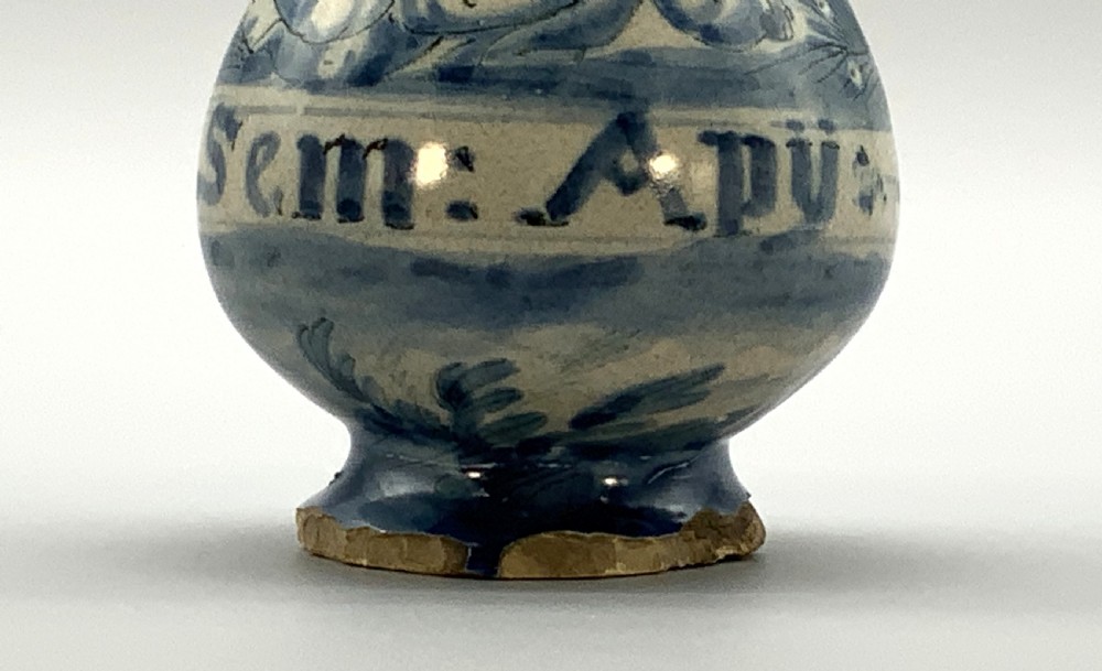 Pair of 17th-century Italian Savona majolica apothecary bottles with cobalt blue hand-painted putti and Latin inscriptions over a tin-glazed ground. View VI