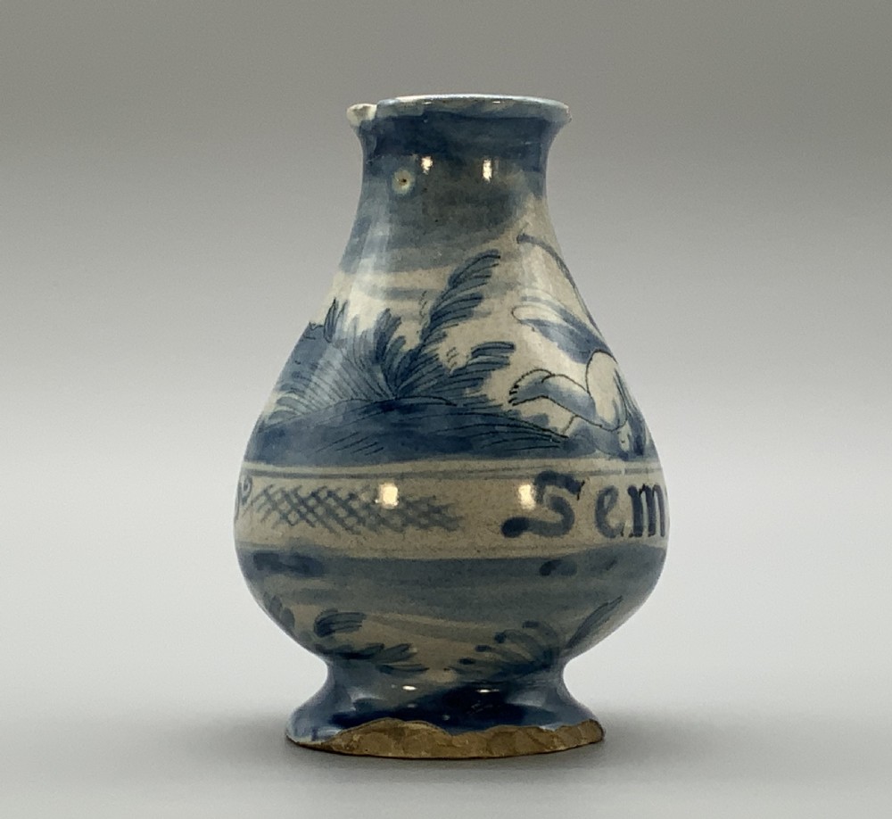 Pair of 17th-century Italian Savona majolica apothecary bottles with cobalt blue hand-painted putti and Latin inscriptions over a tin-glazed ground. View VII