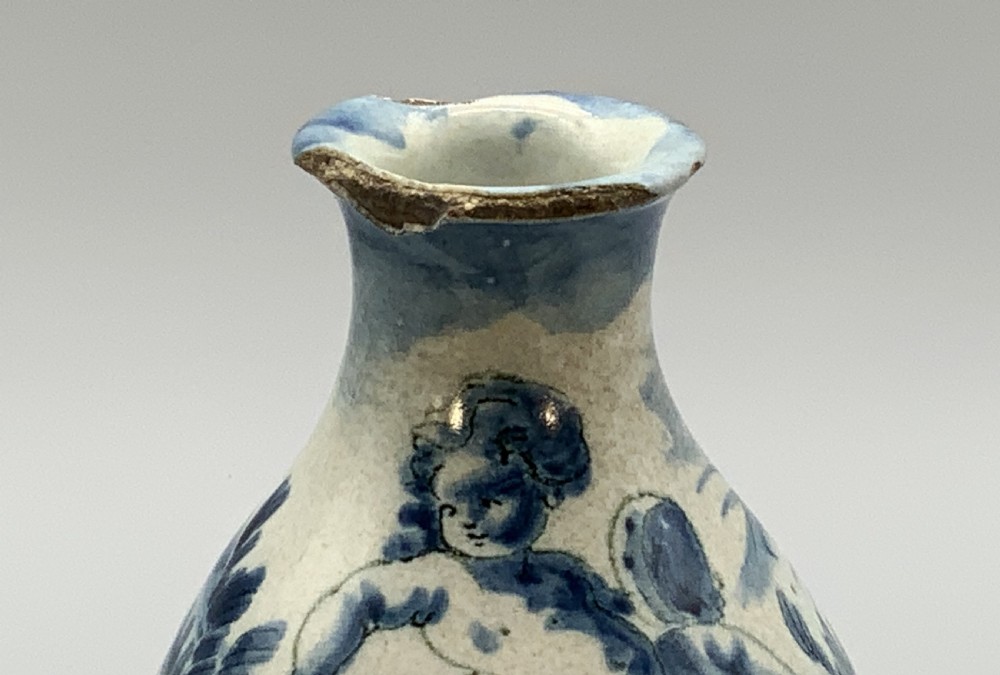 Pair of 17th-century Italian Savona majolica apothecary bottles with cobalt blue hand-painted putti and Latin inscriptions over a tin-glazed ground. View XII