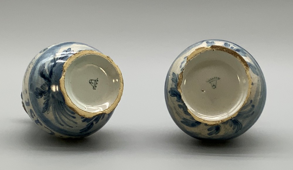 Pair of 17th-century Italian Savona majolica apothecary bottles with cobalt blue hand-painted putti and Latin inscriptions over a tin-glazed ground. View XVI
