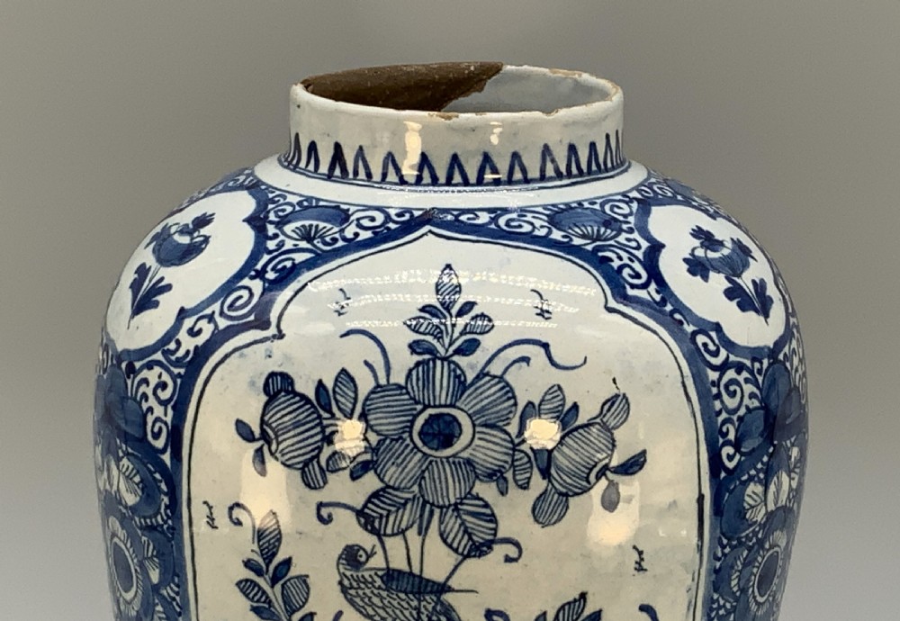 A 17th-century Dutch Delftware vase hand-painted in cobalt blue and white with chinoiserie motifs depicting birds and flowers. View X