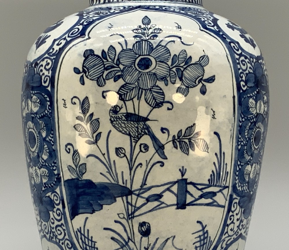 A 17th-century Dutch Delftware vase hand-painted in cobalt blue and white with chinoiserie motifs depicting birds and flowers. View XII