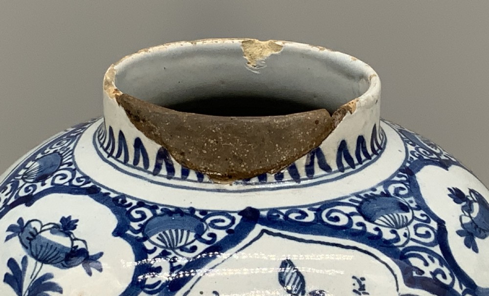A 17th-century Dutch Delftware vase hand-painted in cobalt blue and white with chinoiserie motifs depicting birds and flowers. View XV