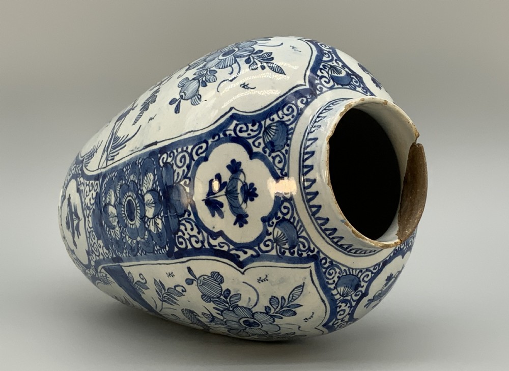 A 17th-century Dutch Delftware vase hand-painted in cobalt blue and white with chinoiserie motifs depicting birds and flowers. View XVIII