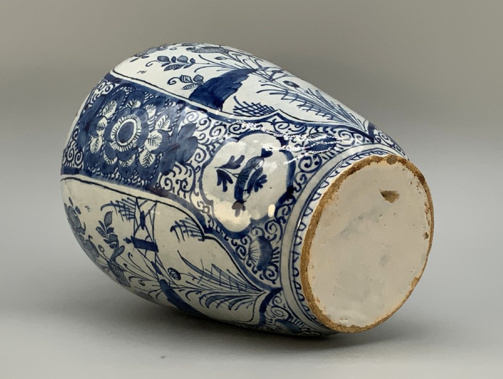 A 17th-century Dutch Delftware vase hand-painted in cobalt blue and white with chinoiserie motifs depicting birds and flowers. View XIX