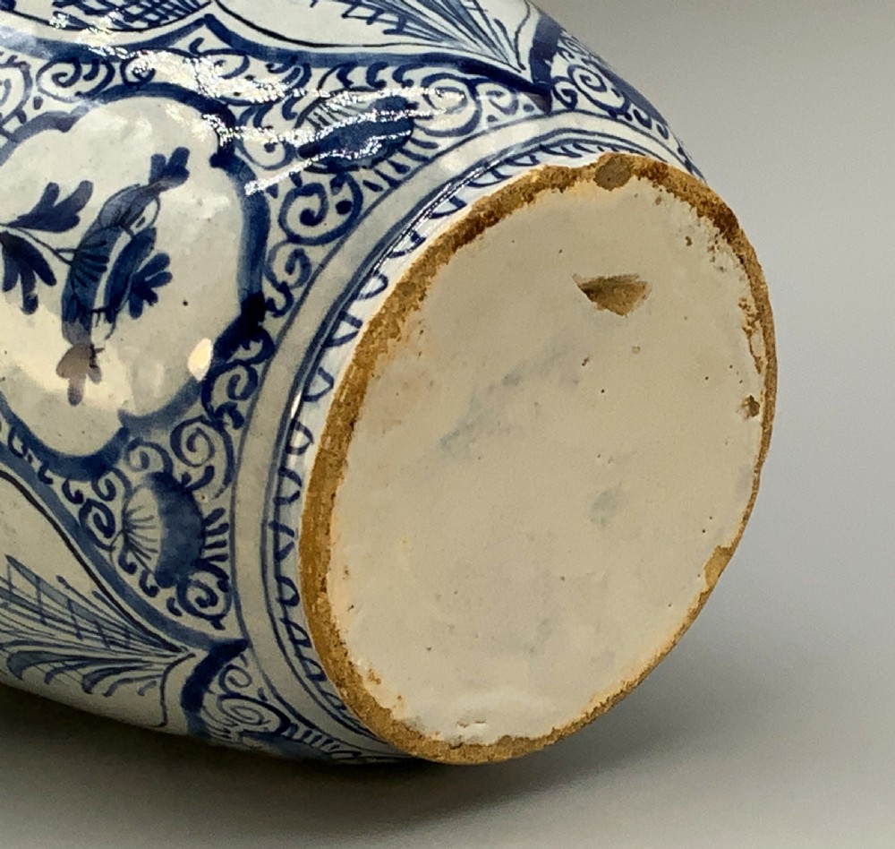 A 17th-century Dutch Delftware vase hand-painted in cobalt blue and white with chinoiserie motifs depicting birds and flowers. View XX