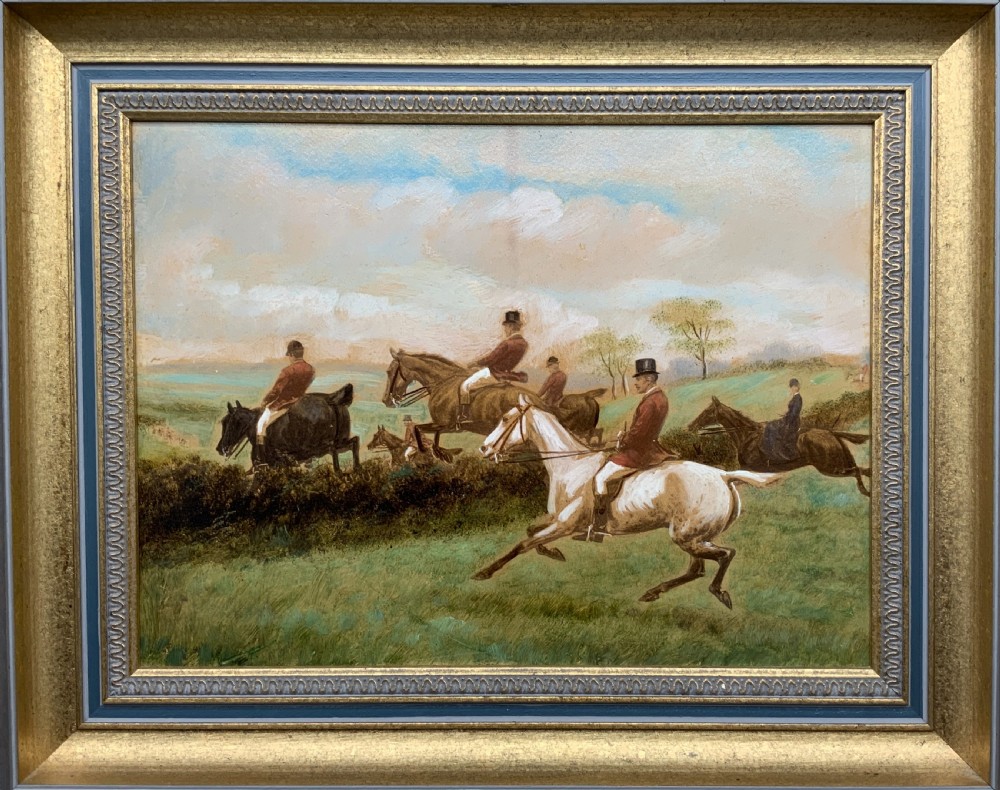 An oil painting on board depicting horseback riders navigating a grassy field, housed in a decorative gilded frame. View XII