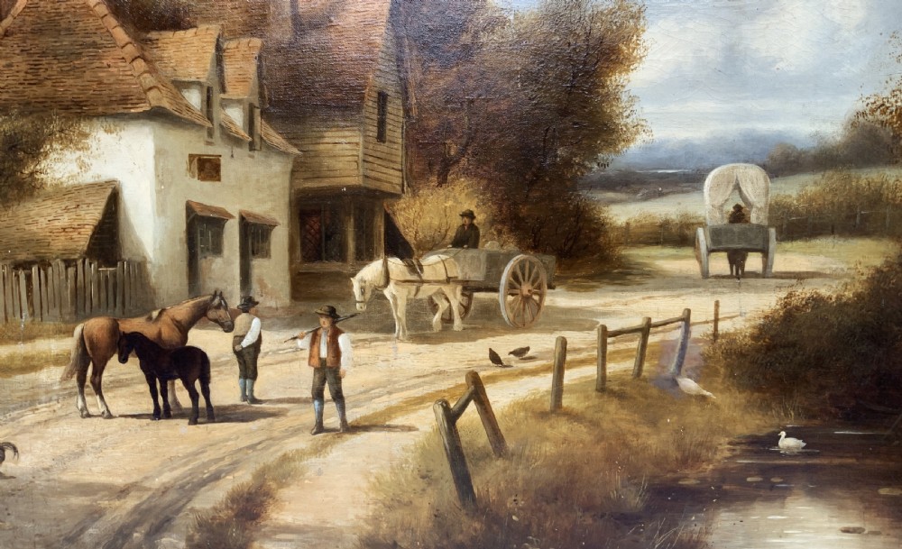 A 19th-century oil painting depicting a rural English village with horses, figures, and cottages on a dirt road, set in a carved gilded frame. View VIII