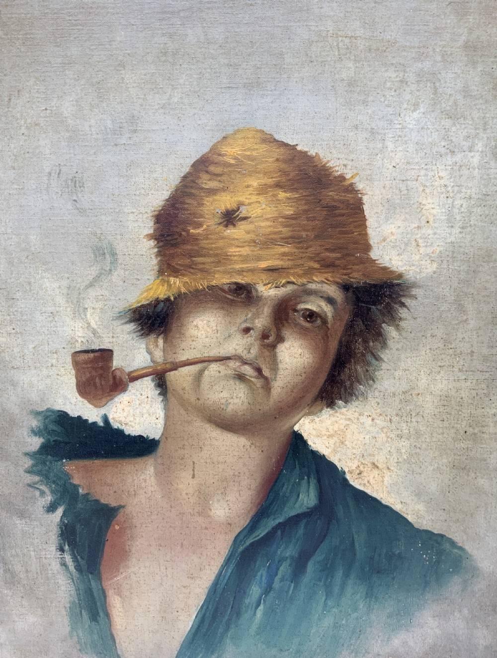 A 19th-century oil portrait of a figure wearing a straw hat and green shirt smoking a pipe, mounted in a gilt frame. View V