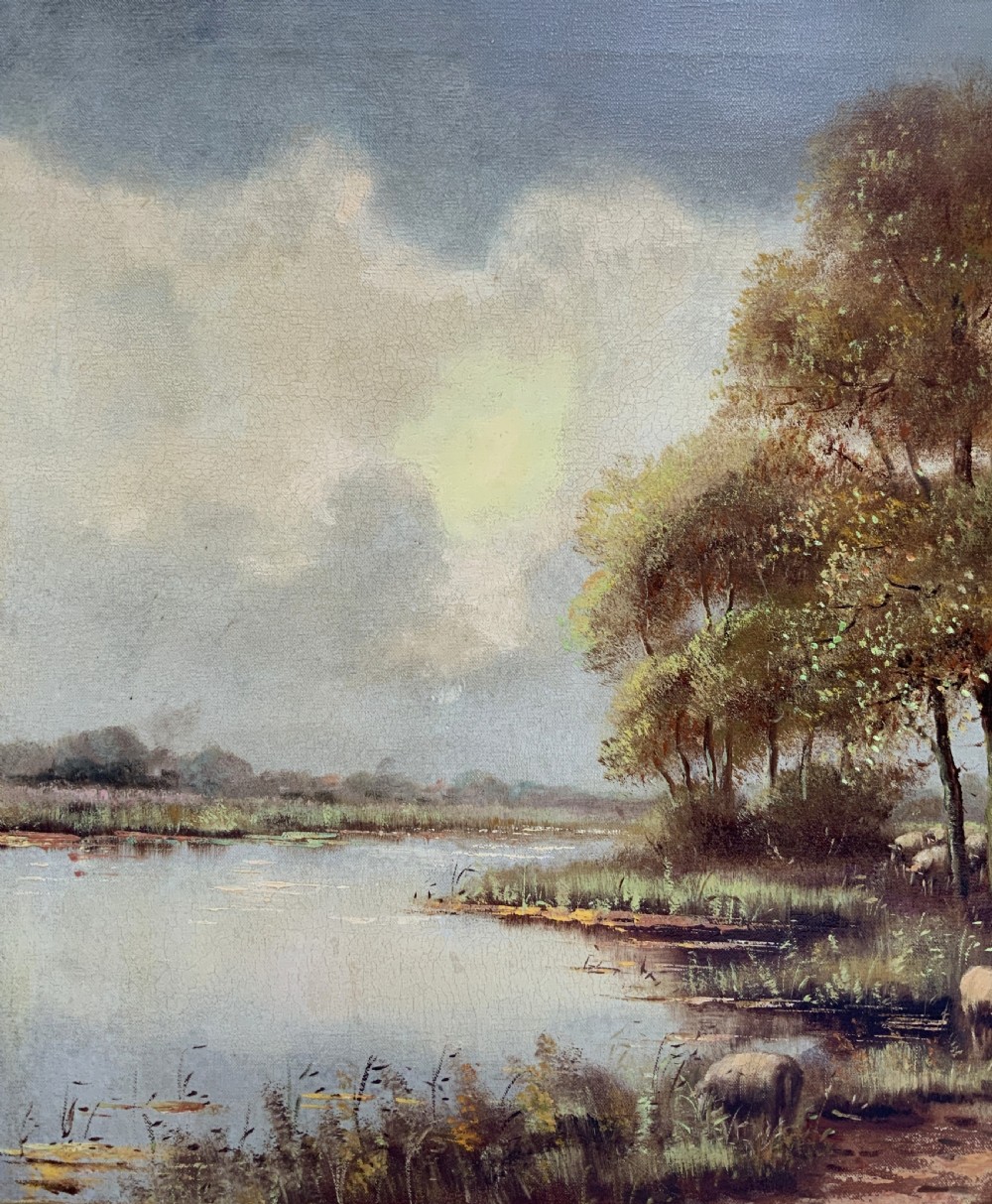 A framed oil painting on canvas depicting a rural autumn landscape with sheep grazing along a riverbank near a cottage under a cloudy sky. View VI