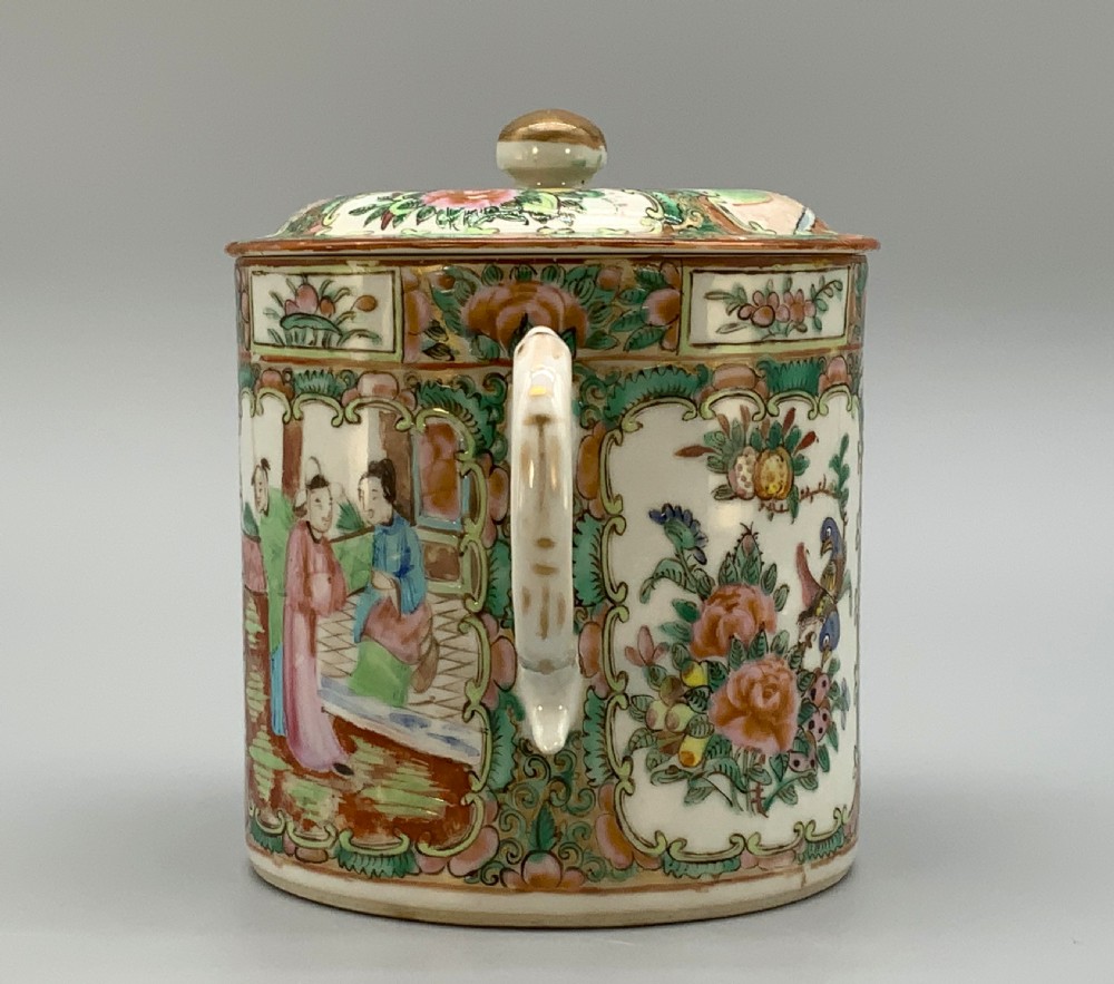A 19th-century Chinese export porcelain barrel-form coffee pot with cover, decorated with famille rose enamel figural reserves and floral patterns. View V
