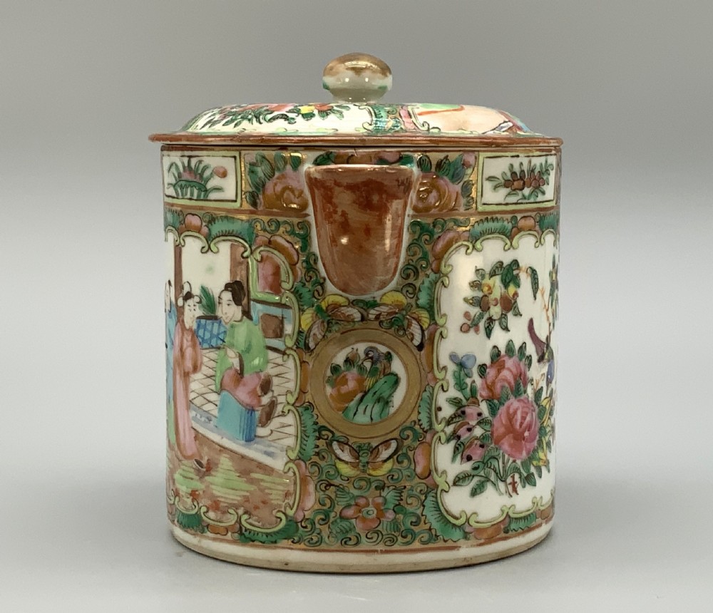 A 19th-century Chinese export porcelain barrel-form coffee pot with cover, decorated with famille rose enamel figural reserves and floral patterns. View VII