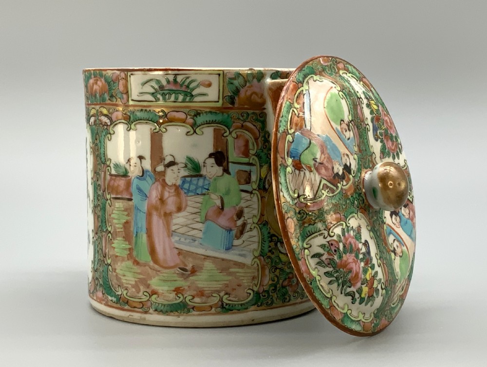 A 19th-century Chinese export porcelain barrel-form coffee pot with cover, decorated with famille rose enamel figural reserves and floral patterns. View IX