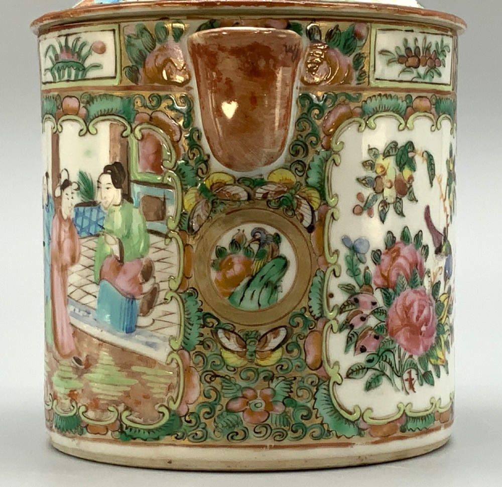 A 19th-century Chinese export porcelain barrel-form coffee pot with cover, decorated with famille rose enamel figural reserves and floral patterns. View XI