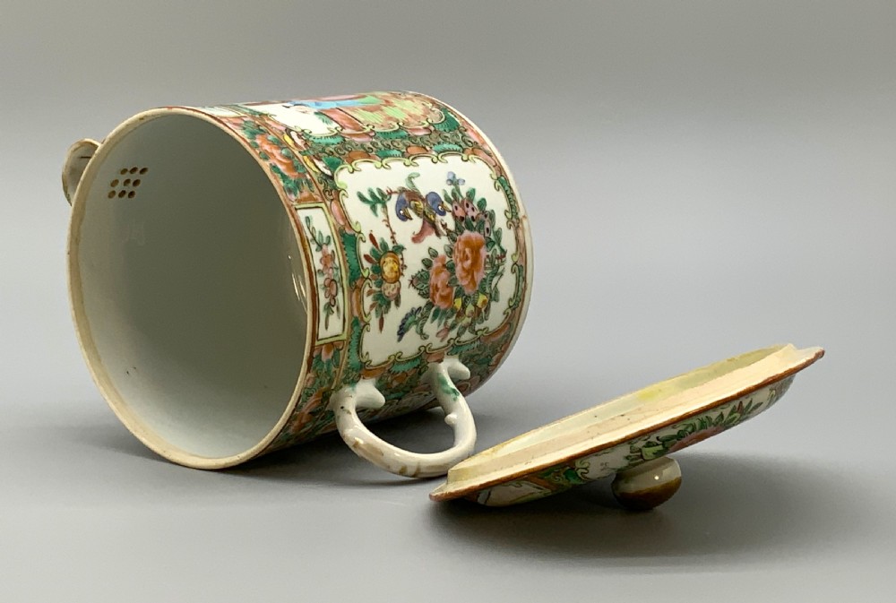 A 19th-century Chinese export porcelain barrel-form coffee pot with cover, decorated with famille rose enamel figural reserves and floral patterns. View XVI