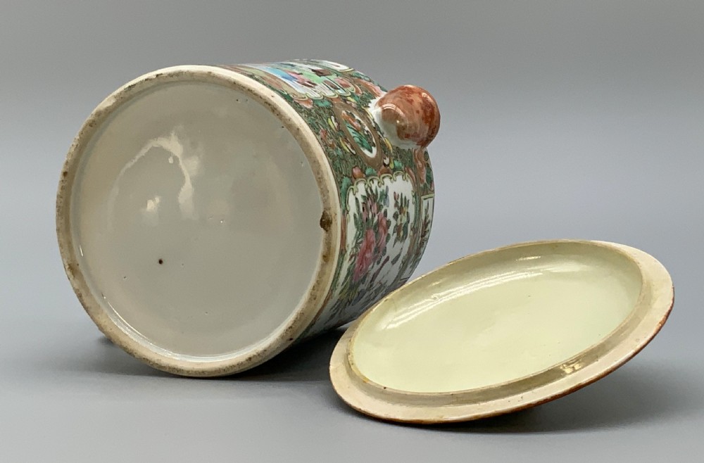 A 19th-century Chinese export porcelain barrel-form coffee pot with cover, decorated with famille rose enamel figural reserves and floral patterns. View XVII