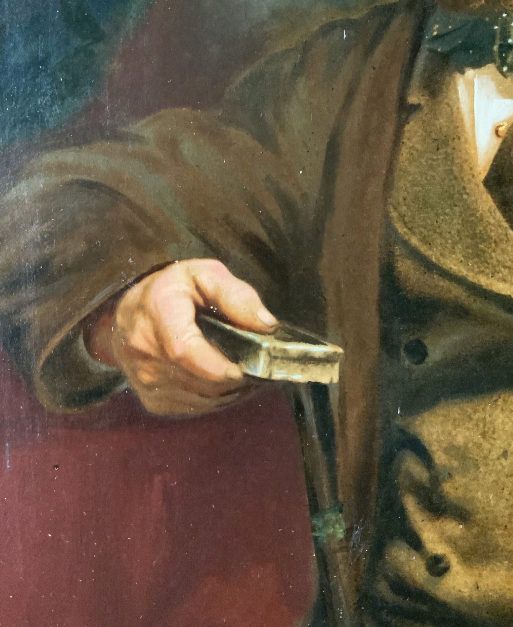 A 19th-century oil painting depicting a seated gentleman in a brown coat and waistcoat holding a small book, encased in an ornate gilded frame. View IX