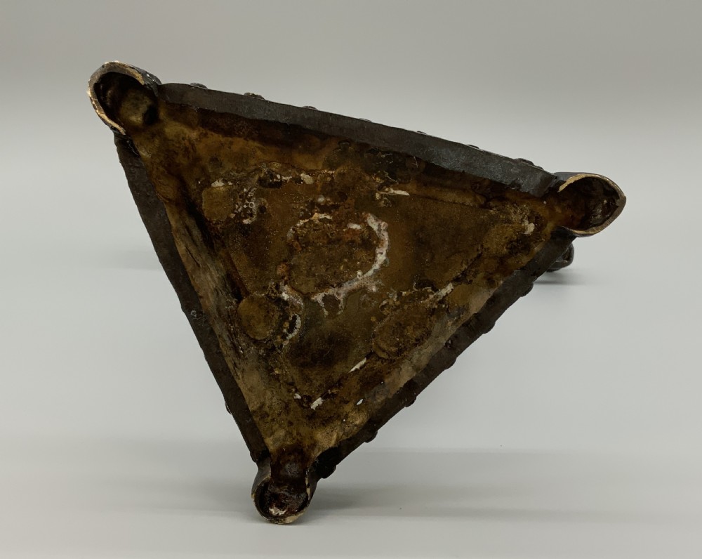 A patinated bronze Egyptian Revival candelabra featuring a female figure with outstretched arms holding two candle sockets, standing on a decorated triangular base. View XVIII