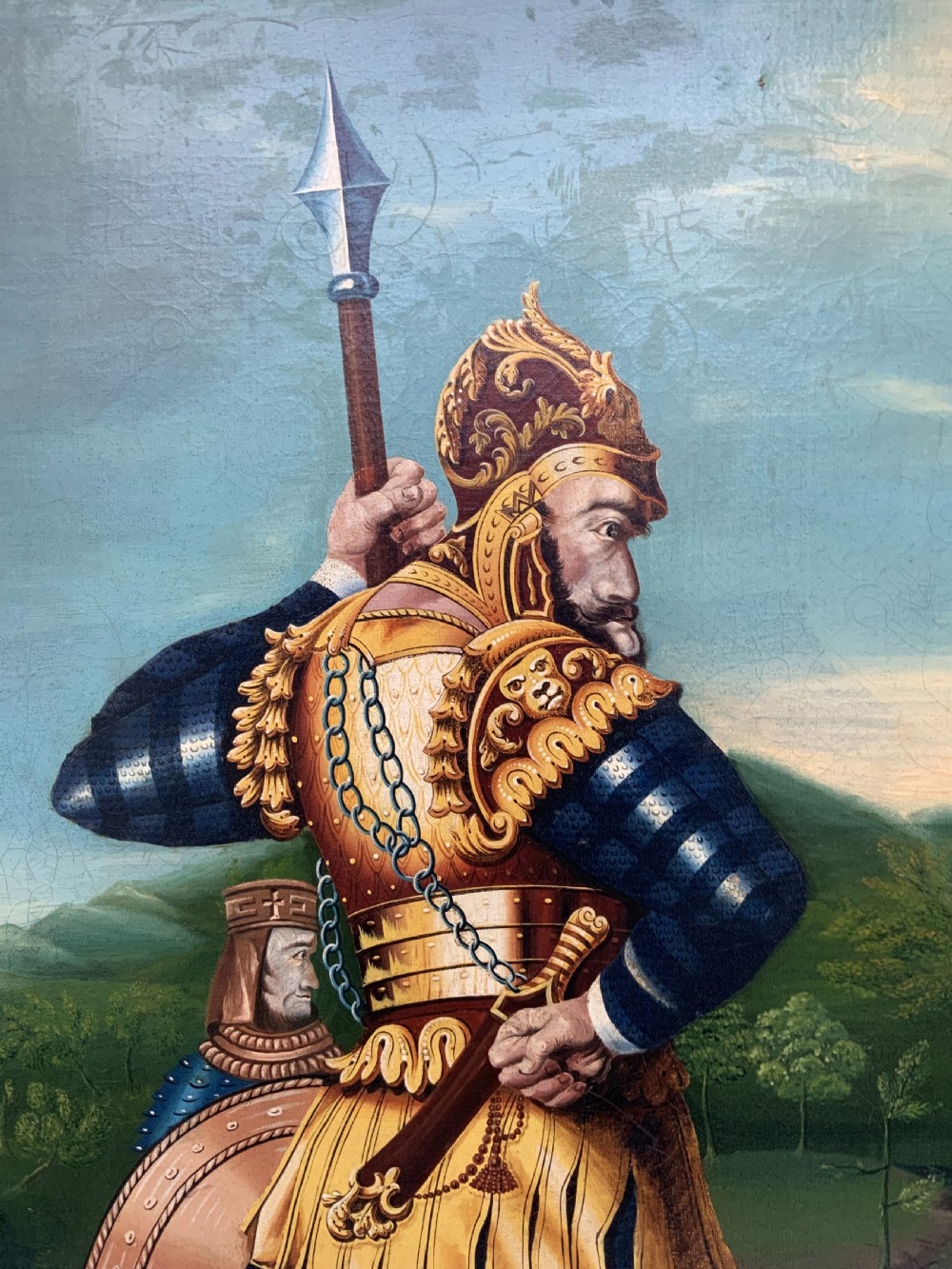 An antique framed oil painting depicting Goliath clad in ornate gold and blue armour holding a spear, with David standing across a stream in the background. View VIII