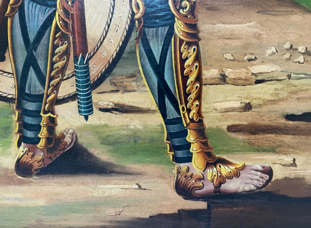 An antique framed oil painting depicting Goliath clad in ornate gold and blue armour holding a spear, with David standing across a stream in the background. View XIV