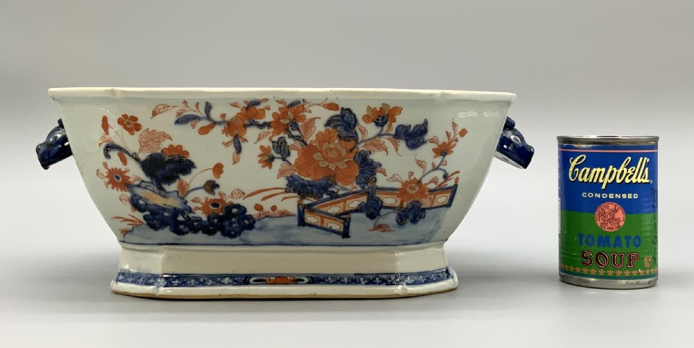 An 18th-century Chinese export porcelain jardiniere decorated with hand-painted floral motifs in cobalt blue and iron-red with blue side handles. View II