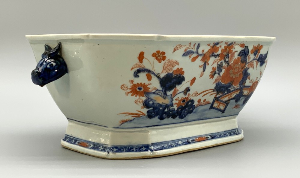 An 18th-century Chinese export porcelain jardiniere decorated with hand-painted floral motifs in cobalt blue and iron-red with blue side handles. View III