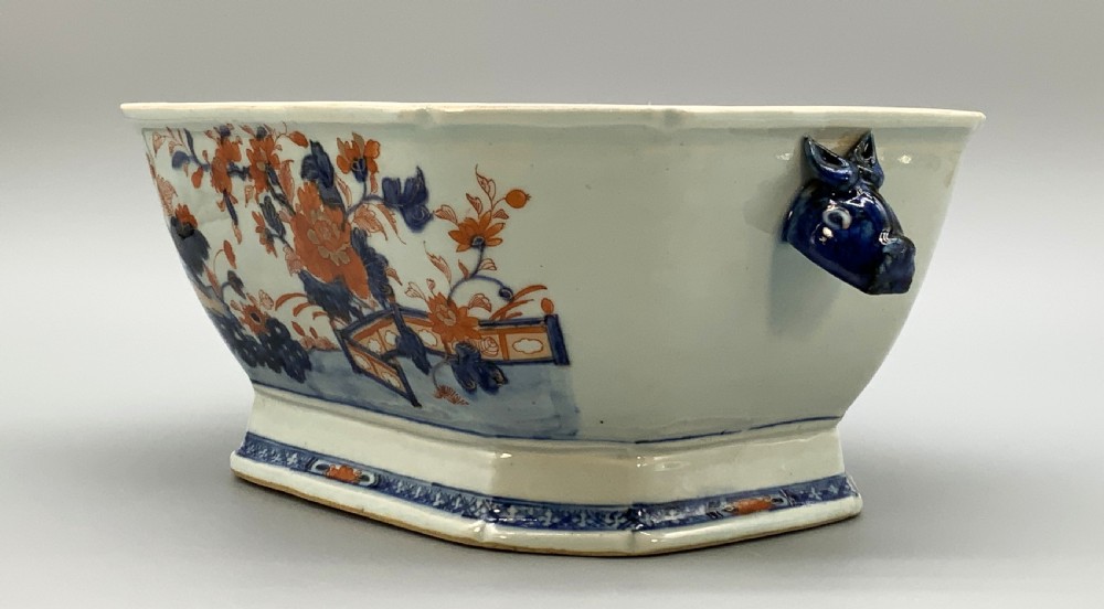 An 18th-century Chinese export porcelain jardiniere decorated with hand-painted floral motifs in cobalt blue and iron-red with blue side handles. View IV